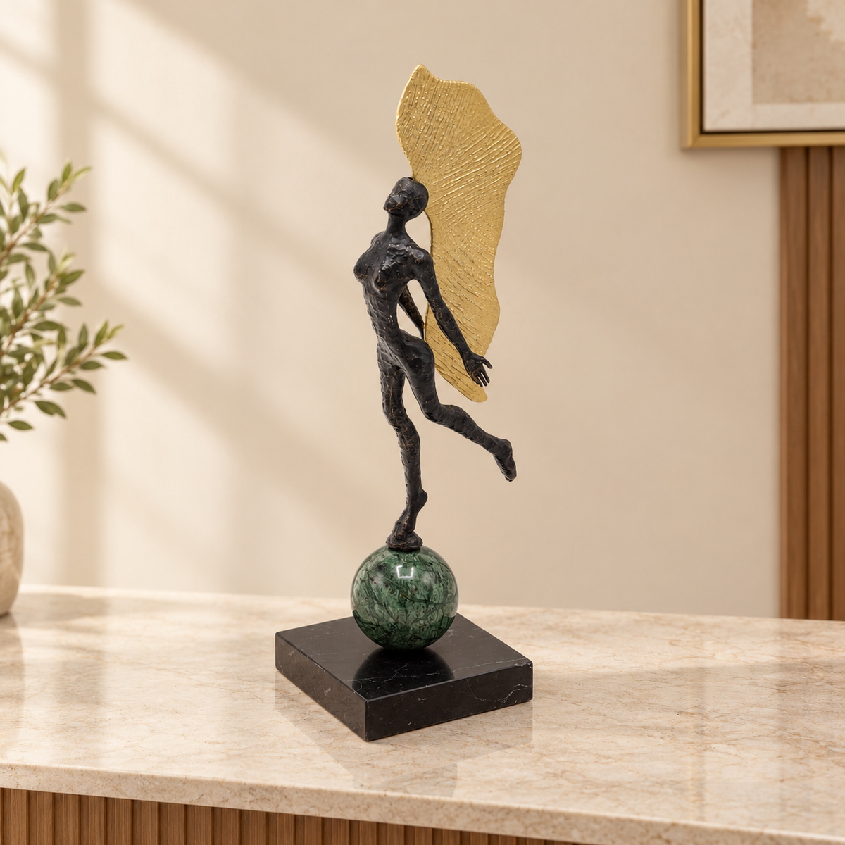 Abstract Female Sculpture with Golden Wing at Zubaidas Homestore