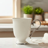 Porcelain Footed Tea Mug with Silver Handle at Zubaidas Homestore 